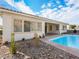 Inviting backyard oasis featuring a refreshing pool and rock landscaping at 3020 Via Venezia, Henderson, NV 89052