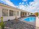 Inviting backyard oasis featuring a refreshing pool and rock landscaping at 3020 Via Venezia, Henderson, NV 89052