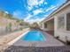 Clean lines of a refreshing blue rectangular pool with rock landscaping at 3020 Via Venezia, Henderson, NV 89052