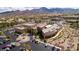 An aerial view of a community center with ample parking and stunning mountain views at 3025 Seaford Peak Dr, Henderson, NV 89052