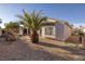 Backyard with desert landscaping, a view of the home's exterior, and ample sunlight at 3025 Seaford Peak Dr, Henderson, NV 89052