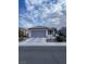 Single story home with a two car garage and front yard at 3025 Seaford Peak Dr, Henderson, NV 89052