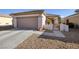 Inviting single-story home with a two-car garage and low-maintenance desert landscaping at 3025 Seaford Peak Dr, Henderson, NV 89052