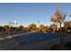 Community basketball court with clear lines and hoop at 304 Whitney Breeze Ave, North Las Vegas, NV 89031