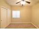 Spacious bedroom with ceiling fan and double door closet at 304 Whitney Breeze Ave, North Las Vegas, NV 89031