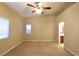 Primary bedroom with ceiling fan and access to bathroom and closet at 304 Whitney Breeze Ave, North Las Vegas, NV 89031