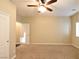 Spacious bedroom with carpeted floor and ceiling fan at 304 Whitney Breeze Ave, North Las Vegas, NV 89031