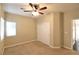 Bright bedroom featuring double closets and ceiling fan at 304 Whitney Breeze Ave, North Las Vegas, NV 89031