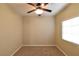 Simple bedroom with ceiling fan and large window at 304 Whitney Breeze Ave, North Las Vegas, NV 89031