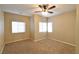 Spacious bedroom with ceiling fan and multiple windows at 304 Whitney Breeze Ave, North Las Vegas, NV 89031