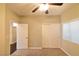 Well-lit bedroom with ceiling fan and access to another room at 304 Whitney Breeze Ave, North Las Vegas, NV 89031