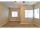 Bright bedroom with multiple windows and ceiling fan at 304 Whitney Breeze Ave, North Las Vegas, NV 89031