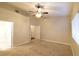 Primary bedroom with ceiling fan, access to bathroom and closet at 304 Whitney Breeze Ave, North Las Vegas, NV 89031