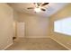 Large bedroom with ceiling fan, window blinds, and plush carpeting at 304 Whitney Breeze Ave, North Las Vegas, NV 89031