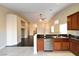 Open kitchen with stainless steel appliances and granite counters at 304 Whitney Breeze Ave, North Las Vegas, NV 89031