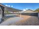 Covered patio overlooking a spacious backyard with gravel at 3425 Irv Marcus Dr, Las Vegas, NV 89108