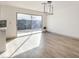 Light-filled dining area with sliding glass doors and hardwood floor at 3425 Irv Marcus Dr, Las Vegas, NV 89108