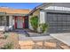 Landscaped front yard with stone pathway leading to the red front door at 3425 Irv Marcus Dr, Las Vegas, NV 89108