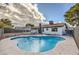 Relaxing kidney shaped pool with surrounding patio at 3425 Irv Marcus Dr, Las Vegas, NV 89108