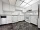 White kitchen with ample cabinetry and marble floor at 3930 University Center Dr # 410, Las Vegas, NV 89119