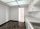 Kitchen with white cabinets, marble floor and view to living room at 3930 University Center Dr # 410, Las Vegas, NV 89119