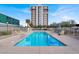 Refreshing blue rectangular pool with surrounding patio at 3930 University Center Dr # 410, Las Vegas, NV 89119