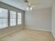 Spacious bedroom with ceiling fan and light-colored flooring at 3988 Salisbury Pl, Las Vegas, NV 89121