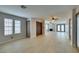 Spacious living room with light wood floors, a fireplace, and access to the backyard at 3988 Salisbury Pl, Las Vegas, NV 89121