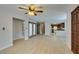 Open living room with hardwood floors, multiple doors, and a view of the kitchen at 3988 Salisbury Pl, Las Vegas, NV 89121