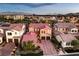 Two-story house with red tile roof and three-car garage at 4063 Villa Rafael Dr, Las Vegas, NV 89141