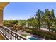 Balcony overlooking pool, yard, and community at 4063 Villa Rafael Dr, Las Vegas, NV 89141