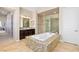 Spacious bathroom with a soaking tub, shower, and dark wood cabinets at 4063 Villa Rafael Dr, Las Vegas, NV 89141