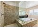 Spa-like bathroom featuring a large shower and granite finishes at 4063 Villa Rafael Dr, Las Vegas, NV 89141