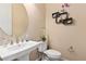 Powder room with pedestal sink and floating shelves at 4063 Villa Rafael Dr, Las Vegas, NV 89141