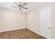 Bright bedroom with ceiling fan and wood-look tile flooring at 4063 Villa Rafael Dr, Las Vegas, NV 89141