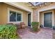 Front patio with brick pavers, seating area, and landscaping at 4063 Villa Rafael Dr, Las Vegas, NV 89141