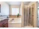 Bathroom with a large soaking tub and separate shower at 4116 W Delhi Ave, North Las Vegas, NV 89032