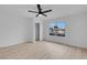 Well-lit bedroom with a large window, ceiling fan and closet at 4182 Mississippi Ave, Las Vegas, NV 89103