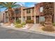 Updated townhome exterior with attractive landscaping and a paved walkway at 4182 Mississippi Ave, Las Vegas, NV 89103