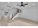 Bright living room featuring light wood-look flooring and a modern ceiling fan at 4182 Mississippi Ave, Las Vegas, NV 89103