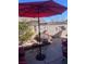 Backyard featuring a patio, umbrella, and mature landscaping at 422 Blush Creek Pl, Las Vegas, NV 89144