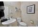 Small bathroom with pedestal sink and toilet at 422 Blush Creek Pl, Las Vegas, NV 89144