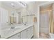 Bathroom featuring double sinks, large mirror, and tub/shower combination at 422 Blush Creek Pl, Las Vegas, NV 89144