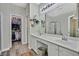 Elegant bathroom with double sinks, a walk-in shower, and updated fixtures at 422 Blush Creek Pl, Las Vegas, NV 89144