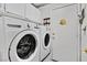 Convenient laundry room with washer and dryer, and access to a hallway at 422 Blush Creek Pl, Las Vegas, NV 89144