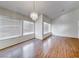 Bright dining room features hardwood floors, large windows, and a chandelier at 4416 Inez Dr, Las Vegas, NV 89130