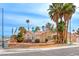 Single-story house with a landscaped yard and palm trees at 4416 Inez Dr, Las Vegas, NV 89130