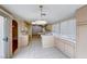 Kitchen with light wood cabinets, tile counters, and tile floors at 4416 Inez Dr, Las Vegas, NV 89130