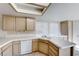 Kitchen with light wood cabinets, tile counters, and tile floors at 4416 Inez Dr, Las Vegas, NV 89130