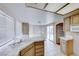 Kitchen with light wood cabinets, tile counters, and tile floors at 4416 Inez Dr, Las Vegas, NV 89130